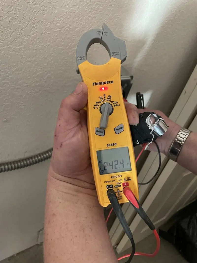 Voltage testing with clamp meter during Hot Tub / Pool Electrical Wiring in Newtown